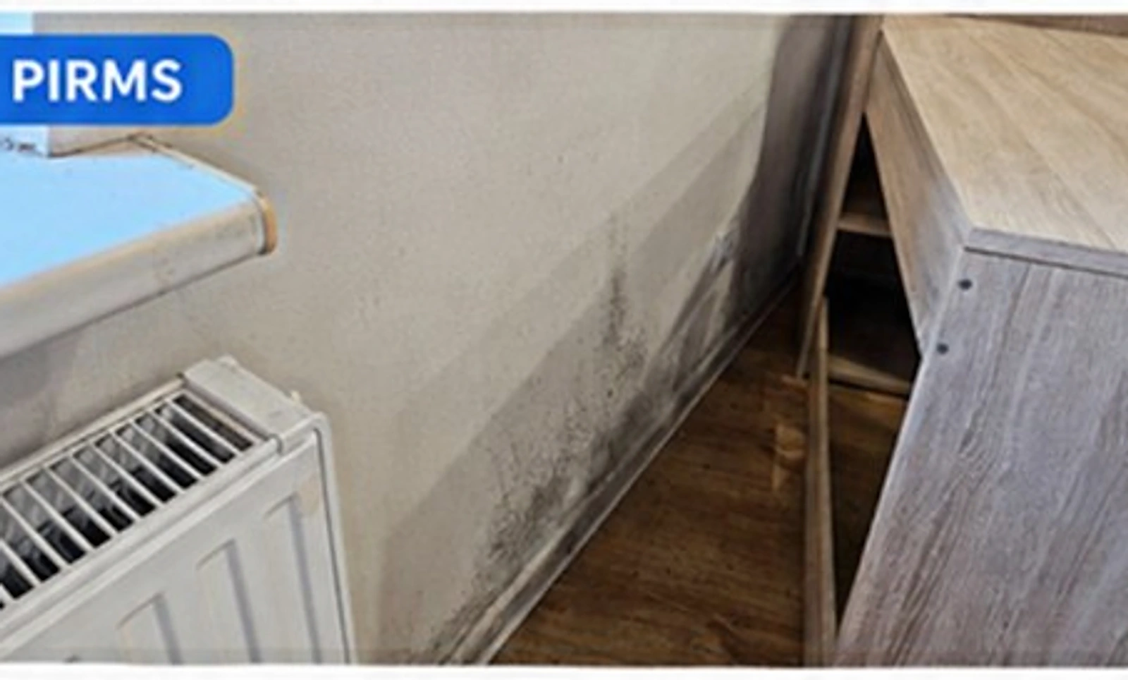 Wall and radiator after mould removal — Before